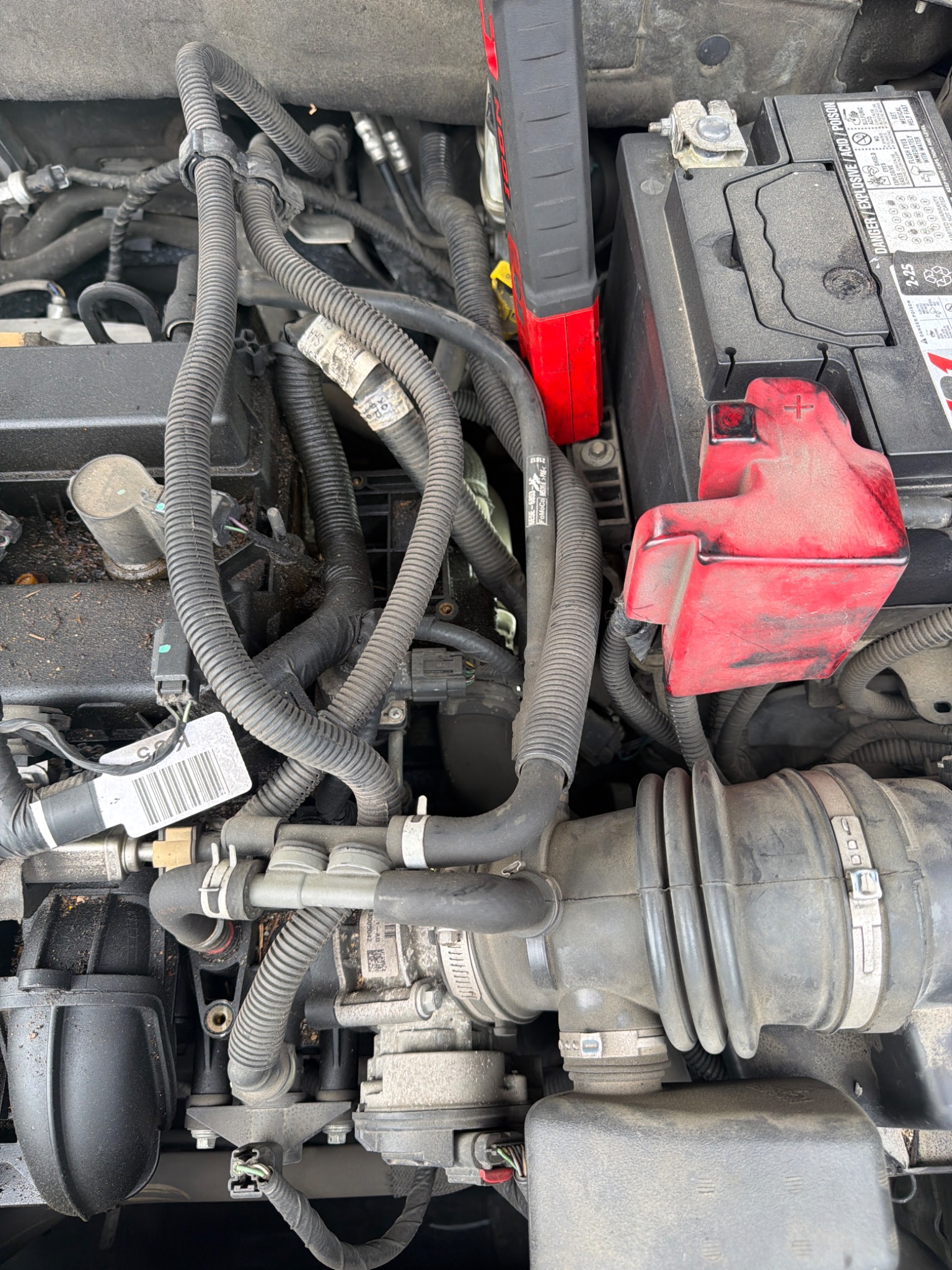 A DH Mobile Mechanics repair in progress inside an engine bay